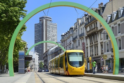 France, Haut Rhin, Mulhouse, tramway going throuth the Arches by artist Daniel Buren in Avenue du President Kennedy, Tour de l'Europe by architect Francois Spoerry in the background