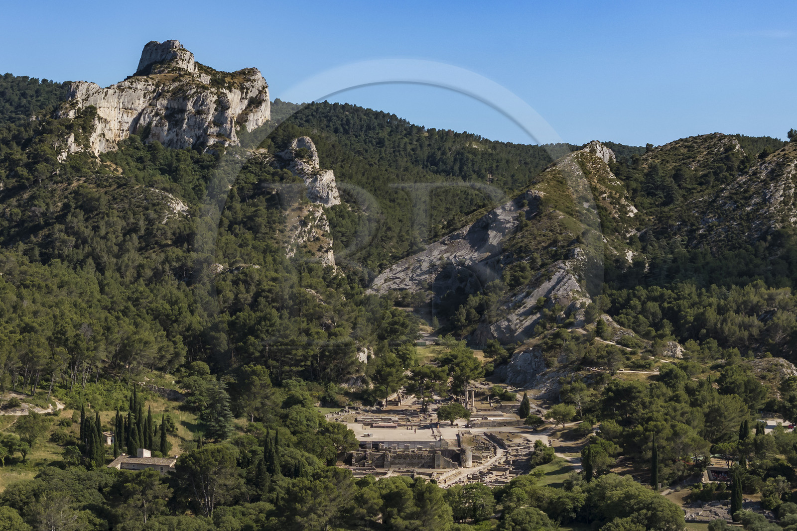 France, Bouches du Rhone, Regional Natural Park of the Alpilles, Saint Remy de Provence, site archéologique de Glanum at the foot of the Alpilles massif (aerial view)
