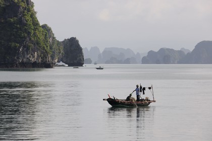 Vietnam, Quang Ninh Province, Halong Bay, listed as World Heritage by UNESCO, fishing boat