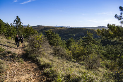 France, Herault, the Causses and the Cevennes, Mediterranean agro pastoral cultural landscape, listed as World Heritage by UNESCO, La Vacquerie et Saint Martin de Castries, hikers on the GR7 trail towards Mont Saint Baudille and Saint-Guilhem-le-Désert