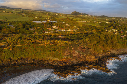 France, Reunion island (French overseas department), Petite-Ile on the southern coast, beach, rocks and sugar cane fields (aerial view)