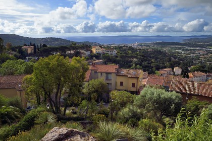 France, Var, Bormes les Mimosas, the old village with chapel Saint-François-de-Paule on the left and the city hall in the middle in the background
