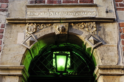 Germany, Bremen, decorated porch of a house in the old town with the maxim All whom I am and that I possess is a gift of the god of Luther