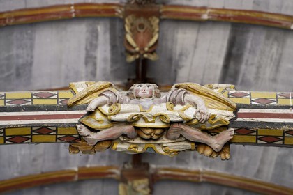 France, Finistere, Pleyben church, wooden painted sculptures on the stringer decorating the vault