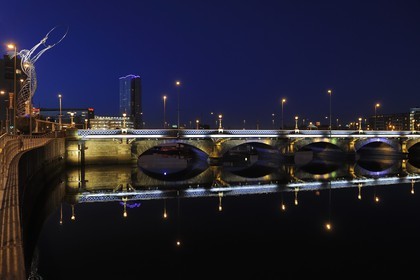 United Kingdom, Northern Ireland, Belfast, the waterfront on the Lagan riverside, Queens Bridge, Beacon of Hope is art metal sculpture by Andy Scott 19.5 metres high constructed in 2007 in Thanksgiving Square and the tallest skyscraper in Ireland Obel Tower
