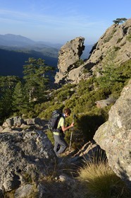 France, Corse du Sud, Alta Rocca, Aiguilles de Bavella (Bavella Needles), hikers on the alpine variante of the GR 20 (Grande Randonnée itinerary)