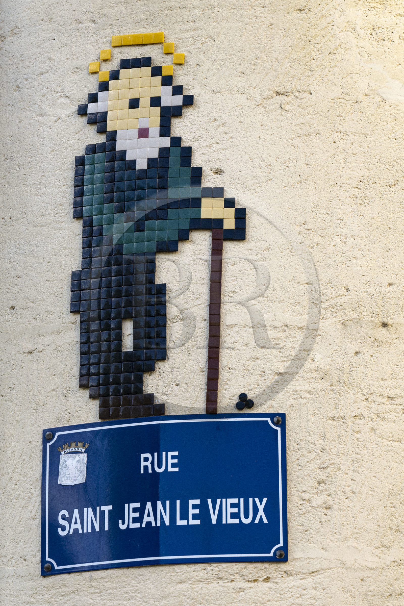 France, Vaucluse, Avignon, Saint-Jean in enamel to decorate the street sign of rue Saint-Jean-le-Vieux by the street artist Mifamosa
