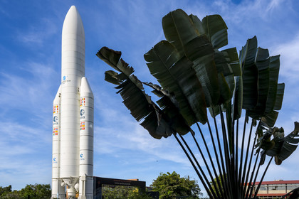 France, French Guiana, Kourou, Guiana Space Centre (Centre spatial guyanais, CSG) also called Europe's Spaceport, life-size replica of the Ariane V rocket and traveler's tree (Ravenala madagascariensis)