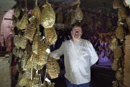 Italy, Emilia Romagna, Polesine Zibello near Parma, Antica Corte Pallavicina, the chef Massimo Spigaroli in his culatello maturing cellar, traditional ham of Parma
