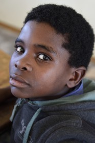 Namibia, Erongo region, Damaraland, the Spitzkoppe in the Namib Desert, Katora Primary School, boy in the grade 4 classroom (around 11 years)