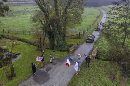 France, Eure, Sainte Colombe prés Vernon, Allied Reconstitution Group (US World War 2 and french Maquis historical reconstruction Association), reenactors in uniform of the 101st US Airborne Division progressing in a jeep Willys welcomed as liberators by villagers and FFI (aerial view)