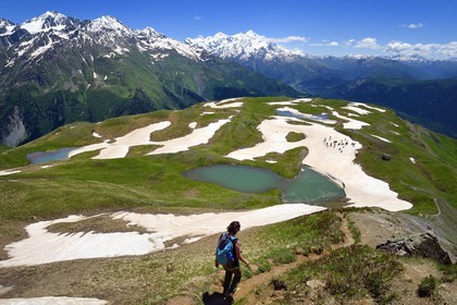 Georgia, Upper Svaneti (Zemo Svaneti), Mestia, hiker on the Koruldi Lake on the foothills of Mount Ushba