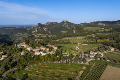 France, Vaucluse, Dentelles de Montmirail mountains, the village of Suzette surrounded by vineyards, the Clapis extended by the Grand Montmirail on the left, the Dentelles Sarrasines in the center and the Grand Travers on the right (aerial view)