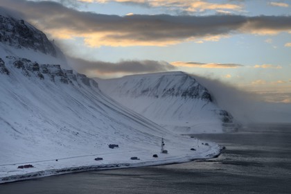 Norway, Svalbard, Spitzbergen, Longyearbyen, mountain bordering the Isfjord under a strong wind (aerial view)