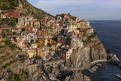Italy, Liguria, Cinque Terre National Park listed as World Heritage by UNESCO, village of Manarola and its harbour (aerial view)
