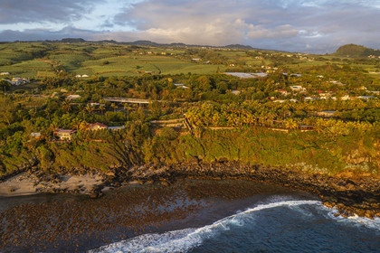 France, Reunion island (French overseas department), Petite-Ile on the southern coast, beach, rocks and sugar cane fields (aerial view)