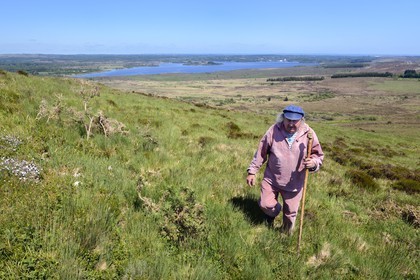 France, Finistere, Parc Naturel Regional d'Armorique (Armorica Regional Natural Park), Monts d'Arree, Brasparts, the Saint Michel mountain (Menez Mikael), the story teller Claude Le Lann in front of the Saint-Michel reservoir