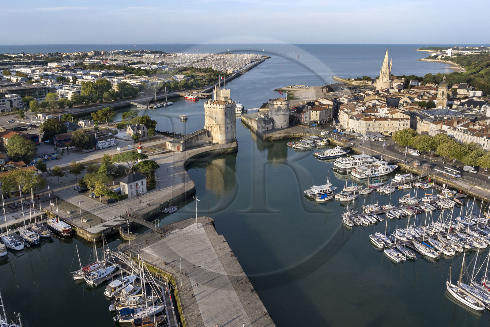 France, Charente Maritime, La Rochelle, the Old Port, Tour Saint Nicolas and Tour de la Chaine protect the entrance to the Old Port, the tour de la Lanterne in the background (aerial view)
