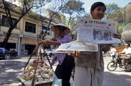 Vietnam, Ho Chi Minh City (Saigon), French newspaper vendor in the street