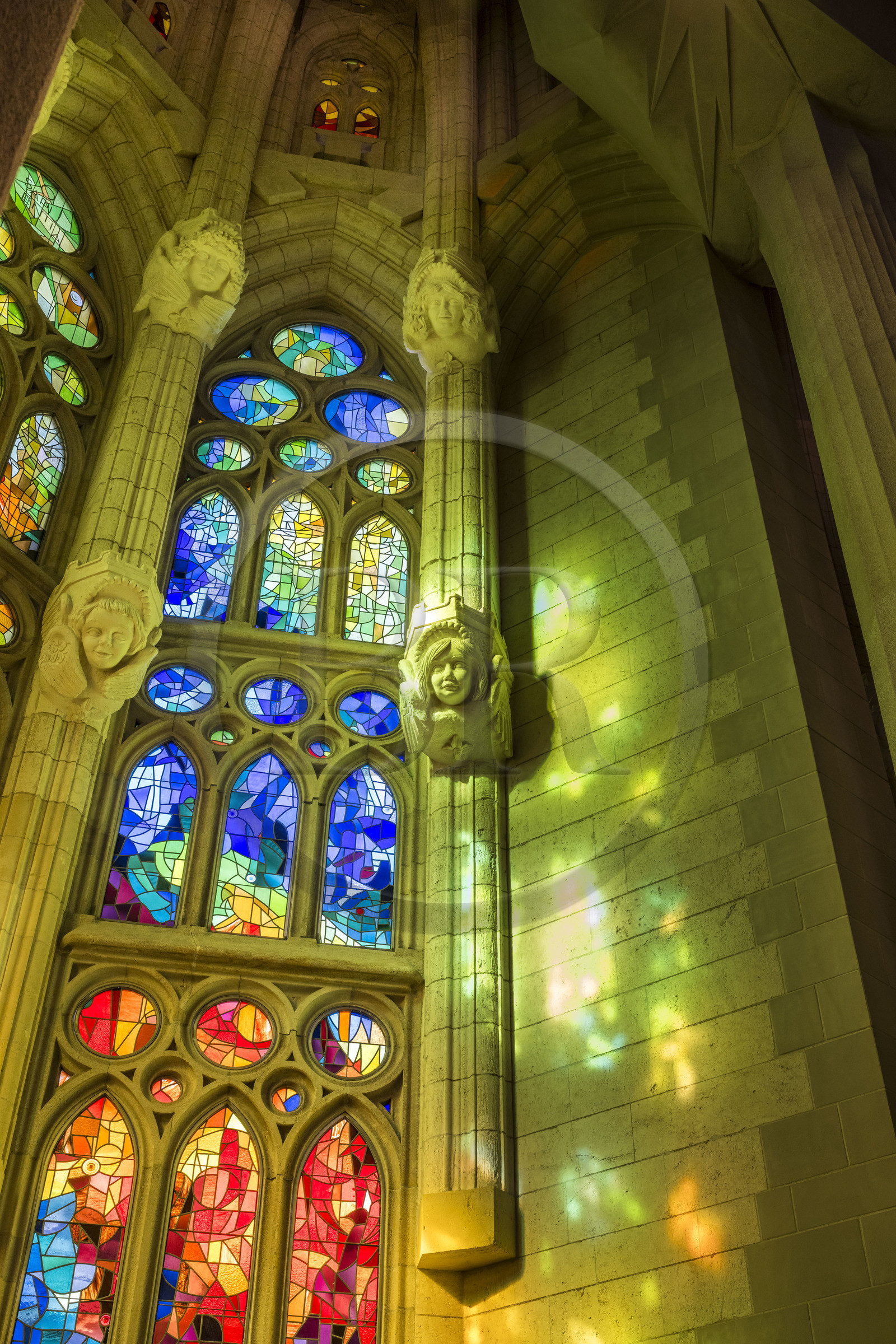 Spain, Catalonia, Barcelona, Eixample district, Sagrada Familia basilica by Catalan modernist architect Antoni Gaudi, listed as a UNESCO World Heritage Site, stained glass windows of the apse above the ambulatory by the Catalan painter and glassmaker Joan Vila-Grau