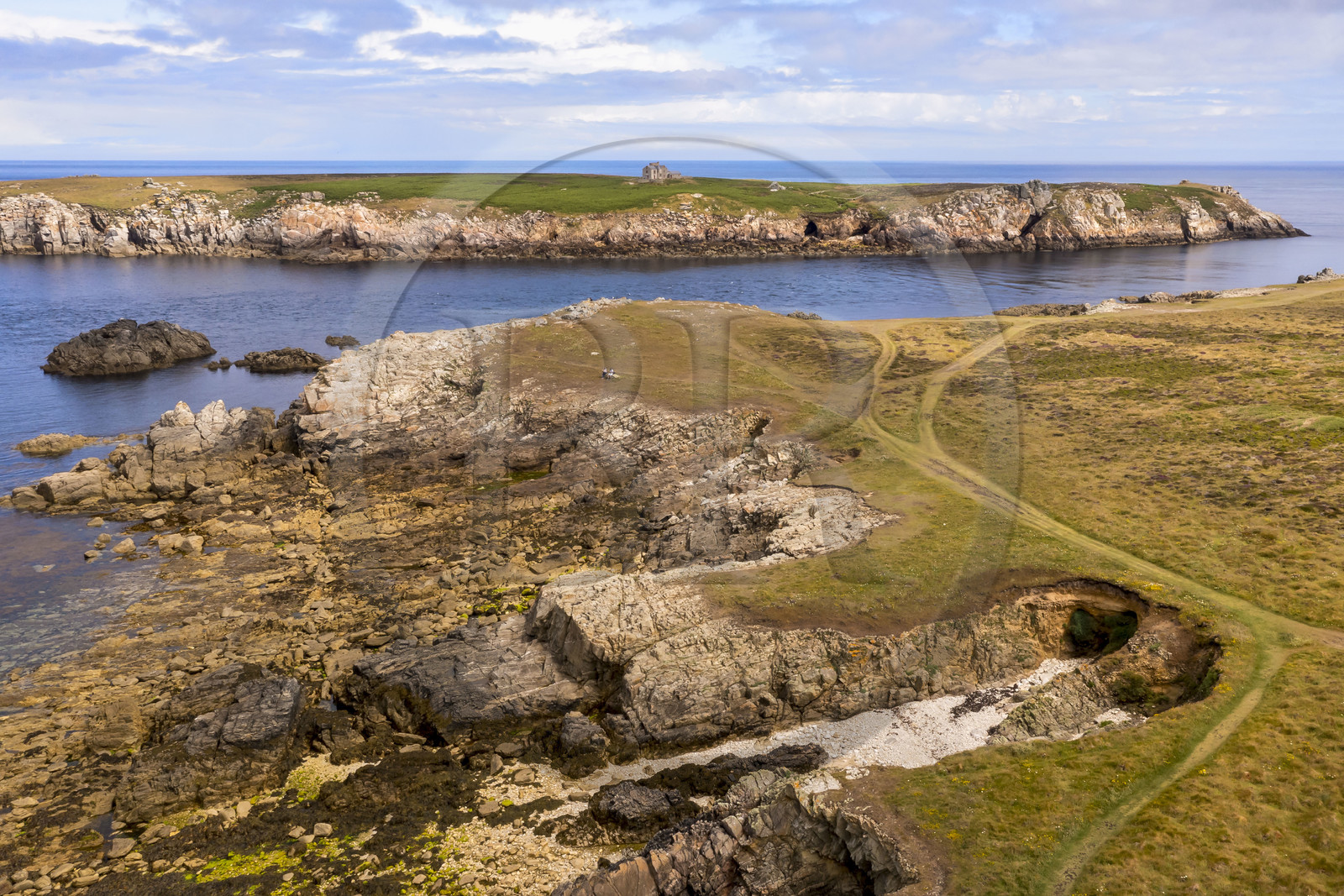 France, Finistère, Iroise Sea, Ouessant Island, Keller Island separated from the north coast by the channel named Penn ar Ru Meur where there is a strong sea current (aerial view)
