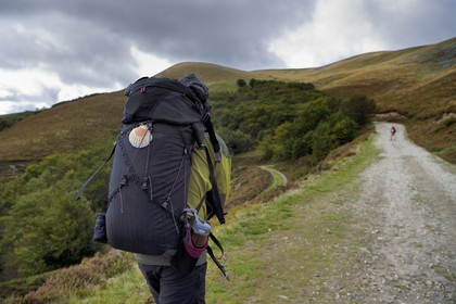 Spain, Basque Country, Navarra, Camino de Santiago (the Way of St. James) between Saint Jean Pied de Port and Roncesvalles, pilgrims at the Lepoeder pass
