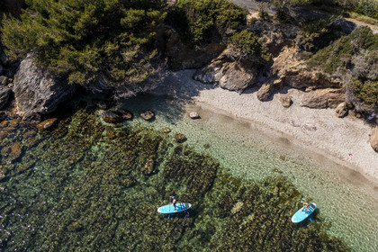 France, Var, Six Fours les Plages, Ile des Embiez, Coucoussa beach, Freestyle windsurfing champion Adrien Bosson on a paddle boarding excursion (aerial view)