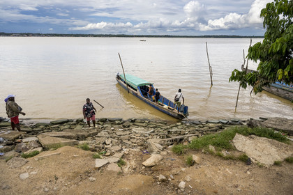 France, French Guiana, Saint-Laurent-du-Maroni, pirogue on the Maroni River, natural border with Suriname in the background