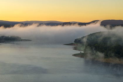 France, Nievre, Regional Natural Park of Morvan, Chaumard, Pannecière lake in the early morning mist (aerial view)