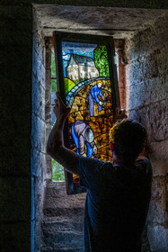 France, Cote d'Or, cultural Landscape of the climates of Burgundy listed as World Heritage by UNESCO, Route des Grands Crus (road of Vintage Wines), vineyard of the Côte de Nuits, Gevrey Chambertin, Domaine Dugat, Bertrand Dugat installs a stained glass window representing the cultivation of the vine
