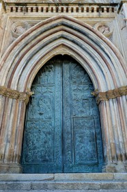 Spain, Extremadura, Guadalupe, Royal Monastery of Santa Maria de Guadalupe listed as World Heritage by UNESCO, the front of the church, Bronze door