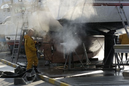 France, Seine Maritime, Pays de Caux, Cote d'Albatre, Fecamp, workers on boats in the slipway