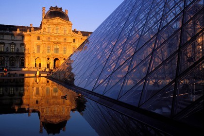 France, Paris, Louvre Museum and Pyramid by the architect Ieoh Ming Pei in the middle of the Cour Carree