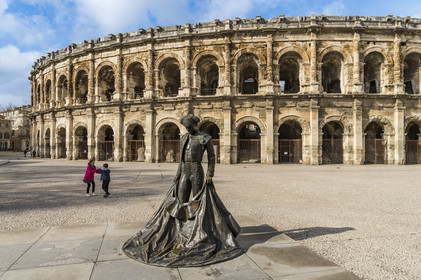 France, Gard, Nimes, Place des Arènes, statue of the bullfighter Nimeno II by Serena Carone from 1994 in front of the Arena