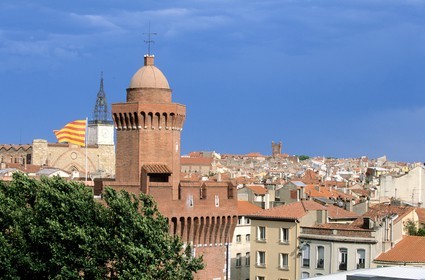 France, Pyrenees Orientales, Perpignan, Castillet with the catalan flag and the Saint john cathedral