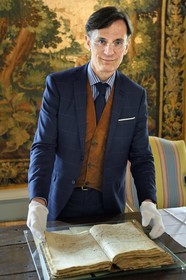 France, Aisne, Château-Thierry, Jean de La Fontaine Museum - city of Chateau-Thierry, the director of the museum pole Nicolas Rousseau presents the poet's original baptismal certificate, subsequently annotated in the margin Jean Delafontaine poete celebre