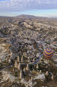 Turkey, Central Anatolia, Nevsehir Province, Cappadocia listed as World Heritage by UNESCO, hot-air ballooning of the village of Göreme (aerial view)