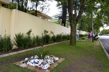 South Africa, Gauteng Province, Johannesburg, the Mandela's house protected by high walls is situated in the pleasant quiet wooded area of Houghton, piles of stones painted by well-wishers
