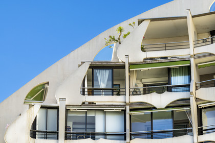 France, Herault, La Grande-Motte, labeled 20th century heritage, The Great Pyramid built in 1974 by the architects Jean Balladur and Jean-Bernard Tostivint, this flagship building for the port of the seaside resort dominates the whole city, forms a curved Y plan and houses a hotel and apartments
