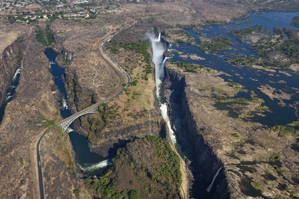 Zimbabwe, Matabeleland North Province,  Zambesi River, the Victoria Falls, listed as World Heritage by UNESCO, bridge that marks the border between Zimbabwe and Zambia (aerial view)
