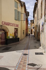 France, Gard, region of the Pays d'Uzege, Saint-Quentin-la-Poterie, the Grand'Rue (main street), the water drainage are also tiled