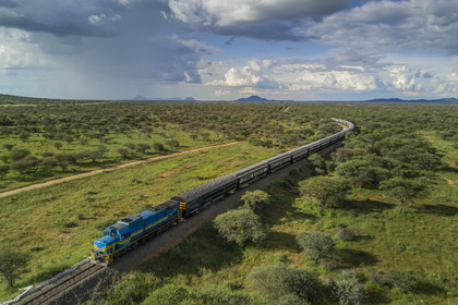 Namibia, Otjozondjupa region, the Shongololo express train crossing the Namibian bush (aerial view)