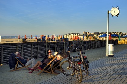 France, Calvados, Pays d'Auge, Deauville, electric bike on the famous planks on the beach