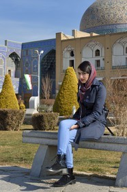 Iran, Isfahan Province, Isfahan, naghsh-i jahan square also known as Imam Khomeiny square, young iranian woman whose name is zahra (no model release) outside Sheikh Lotfollah Mosque