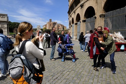 Italy, Lazio, Rome, historical center listed as World Heritage by UNESCO, Colosseum, extras dressed as Roman soldiers to pose with tourists