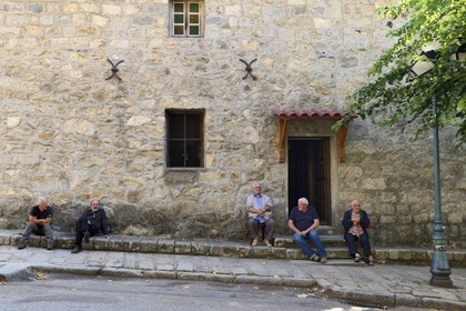 France, Corse du Sud, Alta Rocca, Sainte-Lucie-de-Tallano (Santa Lucia di Tallà), men talking in front of the village church