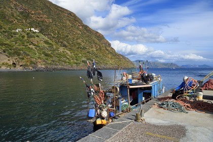 Italy, Sicily, Aeolian Islands, listed as World Heritage by UNESCO, Salina Island, fisherman and his boat in Rinella port