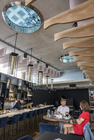 France, Herault, Montpellier, Port Marianne district, Le Nuage building by designer Philippe Starck, restaurant Avva Garden below the aquabike center pool visible through two large portholes