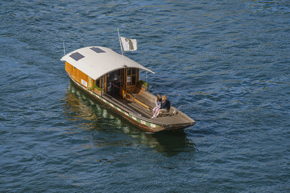 Switzerland, Canton Basel-Stadt, Basel, one of the four small ferries, the Fähri, in operation since the 19th century which connect the banks of the Rhine