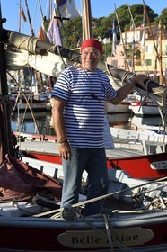 France, Var, Sanary-sur-Mer, traditional fishing boats called pointus in the port, Christian Benet who is president of the Sanary Pointus association